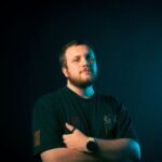 Portrait of a confident man in dramatic lighting, conveying strength and determination.